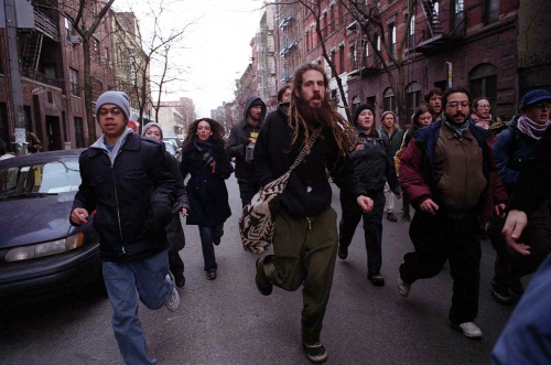 a group of protestors march in the streets